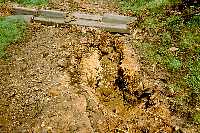 Path erosion caused by storms several days earlier - holes were 2 ft deep in places